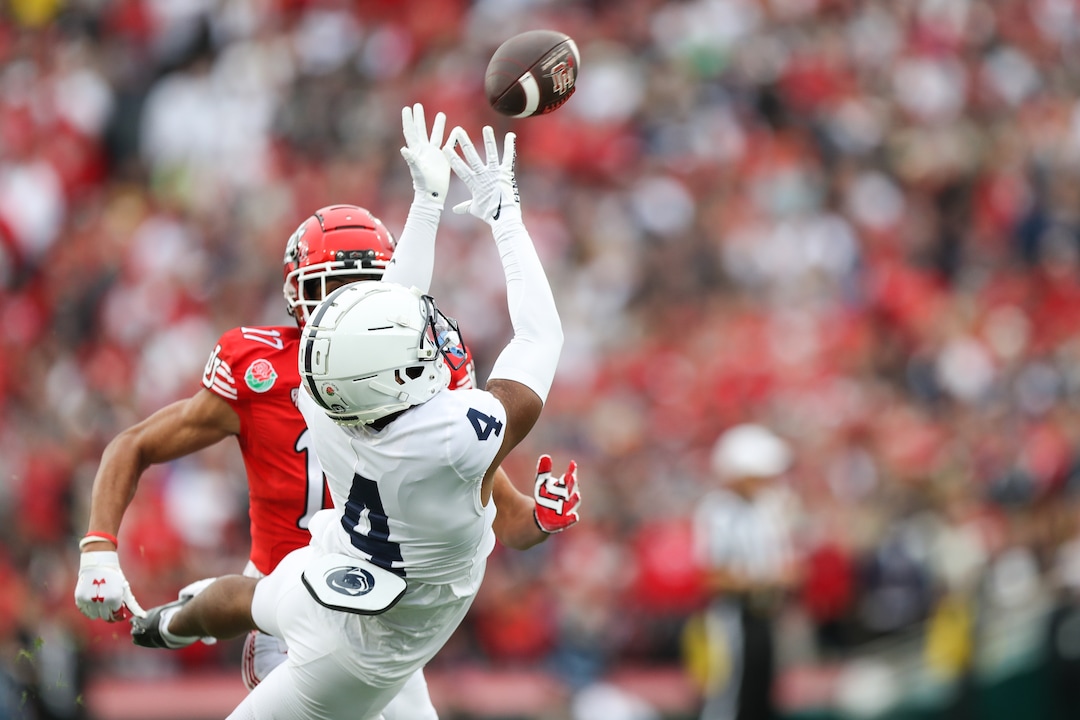 (Meg Oliphant | Special to The Tribune) Kalen King (4) of the Penn State Nittany Lions makes an interception intended for Devaughn Vele (17) of the Utah Utes in the first quarter at Rose Bowl Stadium on Jan. 2, 2023 in Pasadena, Calif.