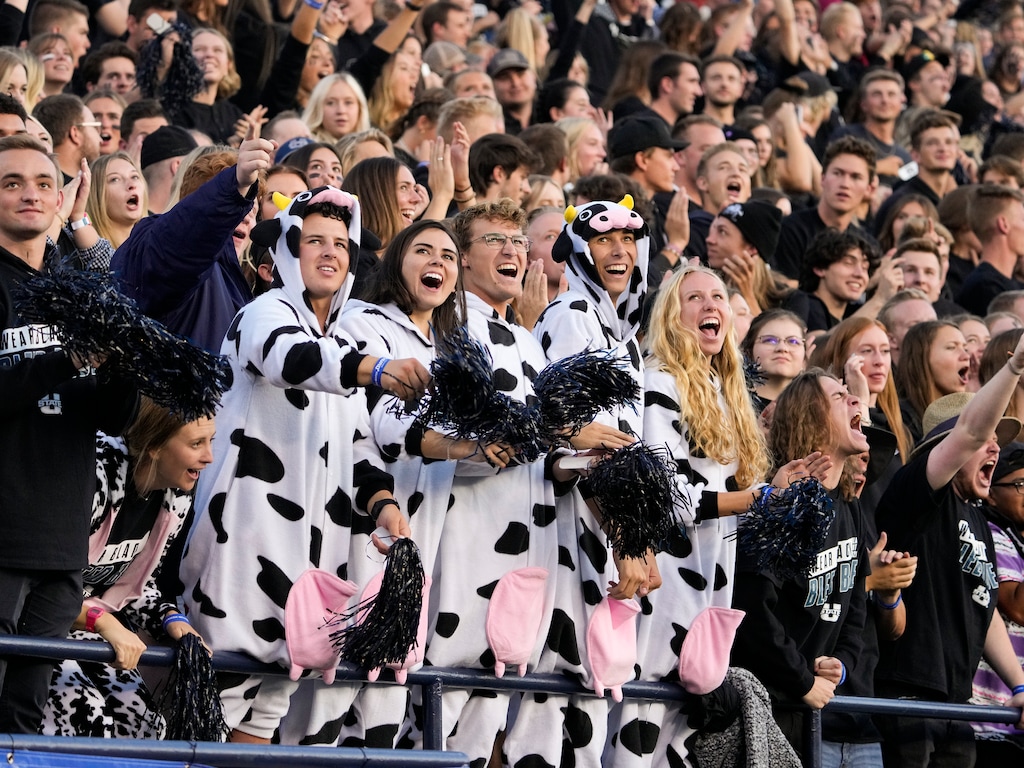 (Leah Hogsten | The Salt Lake Tribune)  Utah State fans cheer on the Aggies prior to their game against Brigham Young University Cougars at Maverik Stadium Oct. 1, 2021. The Cougars attempt a second straight win for the Wagon Wheel, the trophy of the in-state rivalry, while the Aggies will try to recapture the trophy.