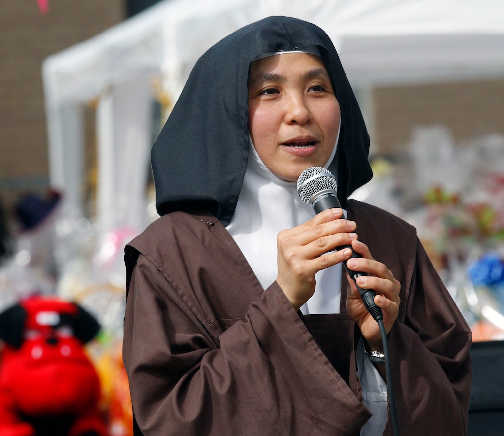 (Al Hartmann  |  Tribune file photo)
Sister Therese welcomes people to the Carmelite Fair in 2017. The event won't take place this year because of the coronavirus.
