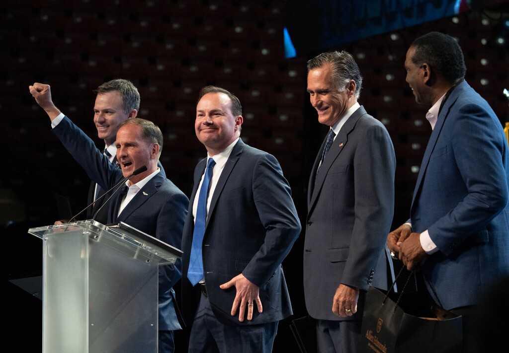 (Francisco Kjolseth | The Salt Lake Tribune) Utah representatives from left, Blake Moore, Chris Stewart, Senators Mike Lee and Mitt Romney and Rep. Burgess Owens take the stage before delegates attending the Utah Republican Party’s 2021 Organizing Convention at the Maverik Center in West Valley City on Saturday, May 1, 2021.