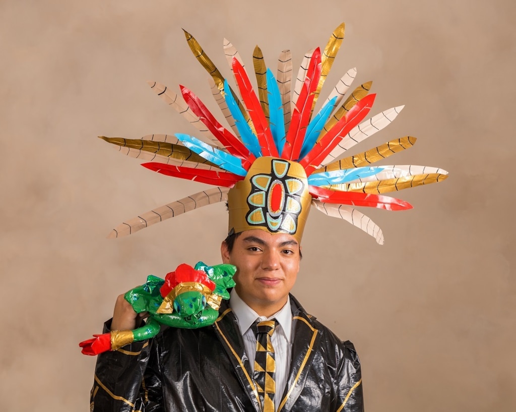 (Morgan Alley | Shurtape) Ian Hernandez Rojas poses in his tux creation for the 2023 Stuck at Prom Scholarship Contest. His suit pays homage to his Salvadoran culture.