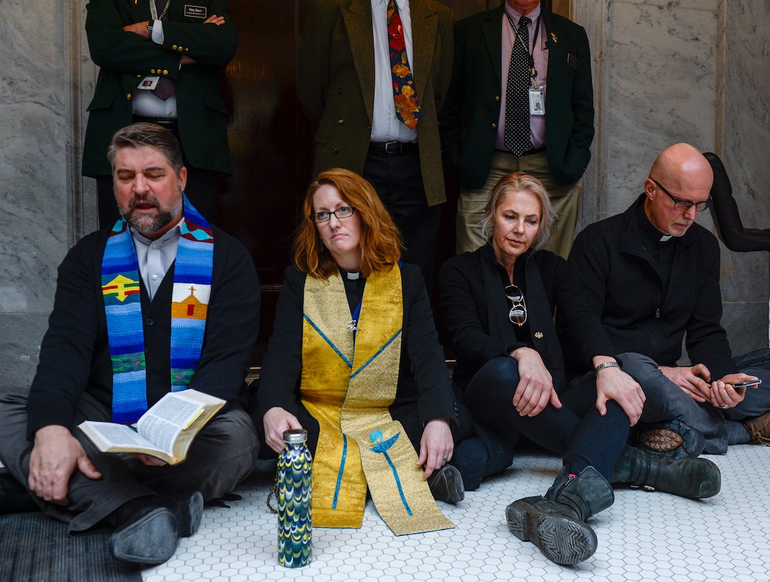 Leah Hogsten  |  The Salt Lake Tribune  Faith leaders l-r Rev. Curtis Price with The First Baptist Church of Salt Lake City, Rev. Monica Dobbins with the First Unitarian Church of Salt Lake City, Zen Buddhist Anna Zumwalt and Pastor David Nichols with Mt. Tabor Lutheran Church demonstrate in opposition to SB96 outside the Utah House chambers, Feb. 8, 2019. 