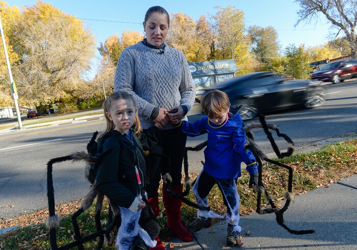 (Francisco Kjolseth  |  The Salt Lake Tribune)  Anna Simmon describes the harrowing Halloween night two years ago when her twin children, Eleanor, left, and Frederick, along with her husband and niece were struck by a truck turning left across traffic at 2100 South and 400 East in Salt Lake. Revisiting the scene she witnessed while following close behind, Simmon relayed her story in hopes of keeping trick-or-treaters of all ages safe this year. 