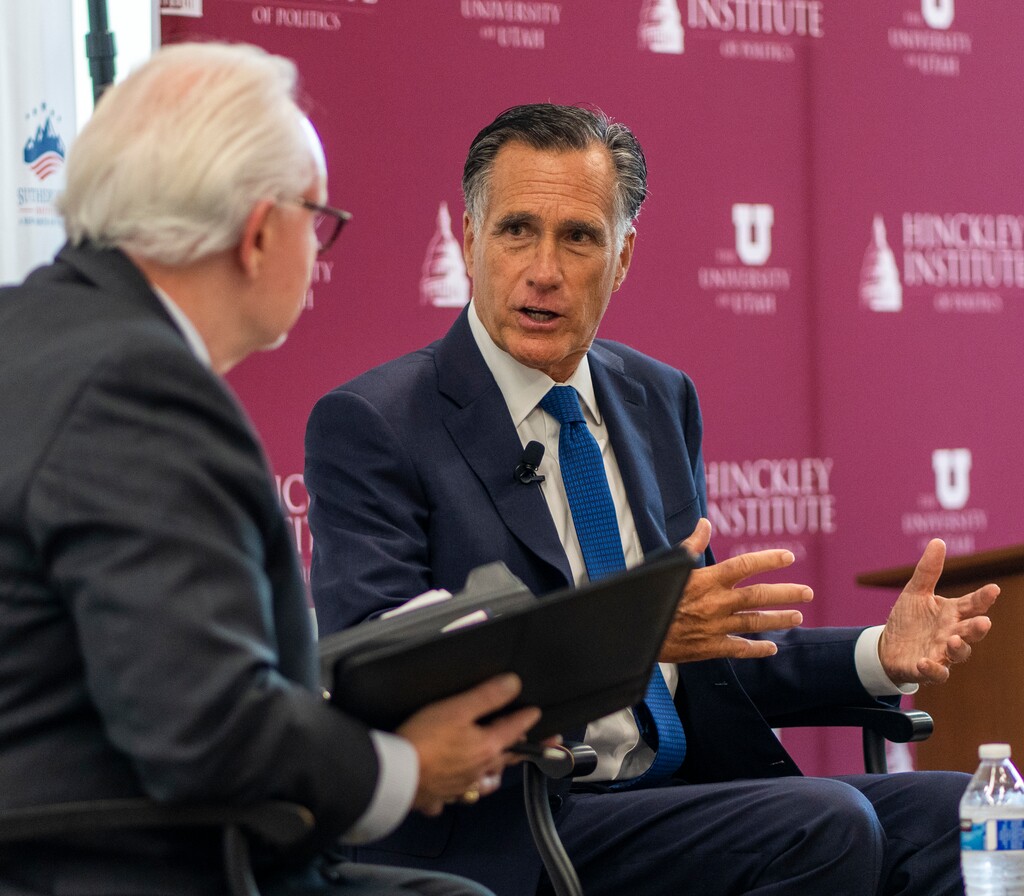 (Rick Egan | The Salt Lake Tribune)  Rick Larsen, from the Sutherland Institute chats with Sen. Mitt Romney, at the Hinckley Institute of Politics, on Monday, Aug. 21, 2023.