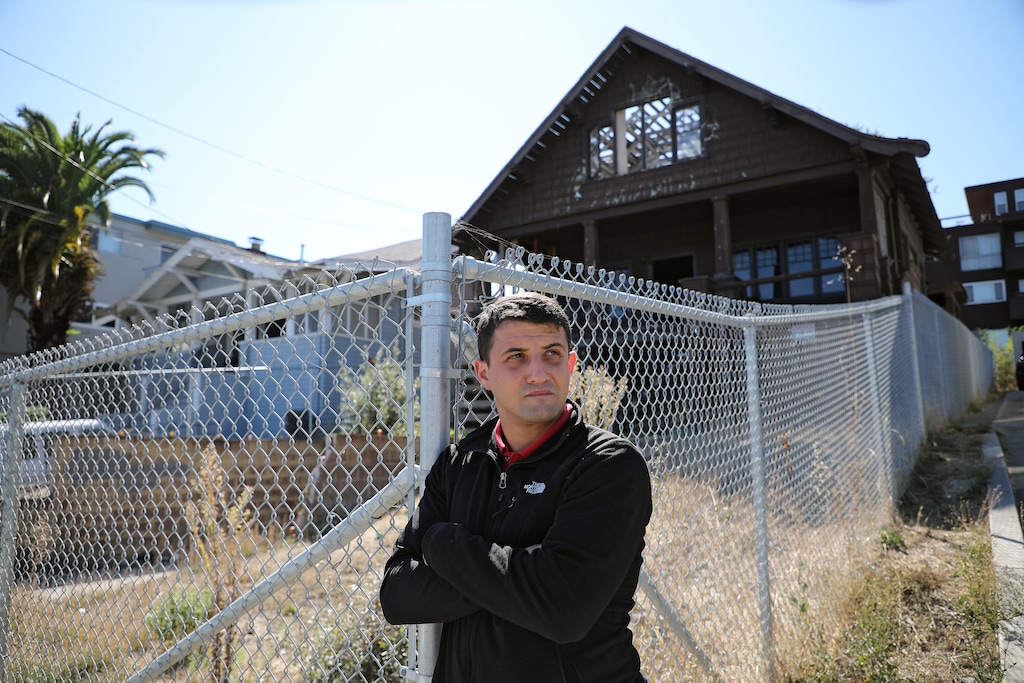 (Jim Wilson | The New York Times) Gene Gorelik, a property developer and an aggressive critic of the homeless, stands by a property he once owned in Oakland, Calif., Oct. 3, 2019. California may pride itself on its commitment to tolerance and liberal values, but across the state, record levels of homelessness have spurred a backlash against those who live on the streets.