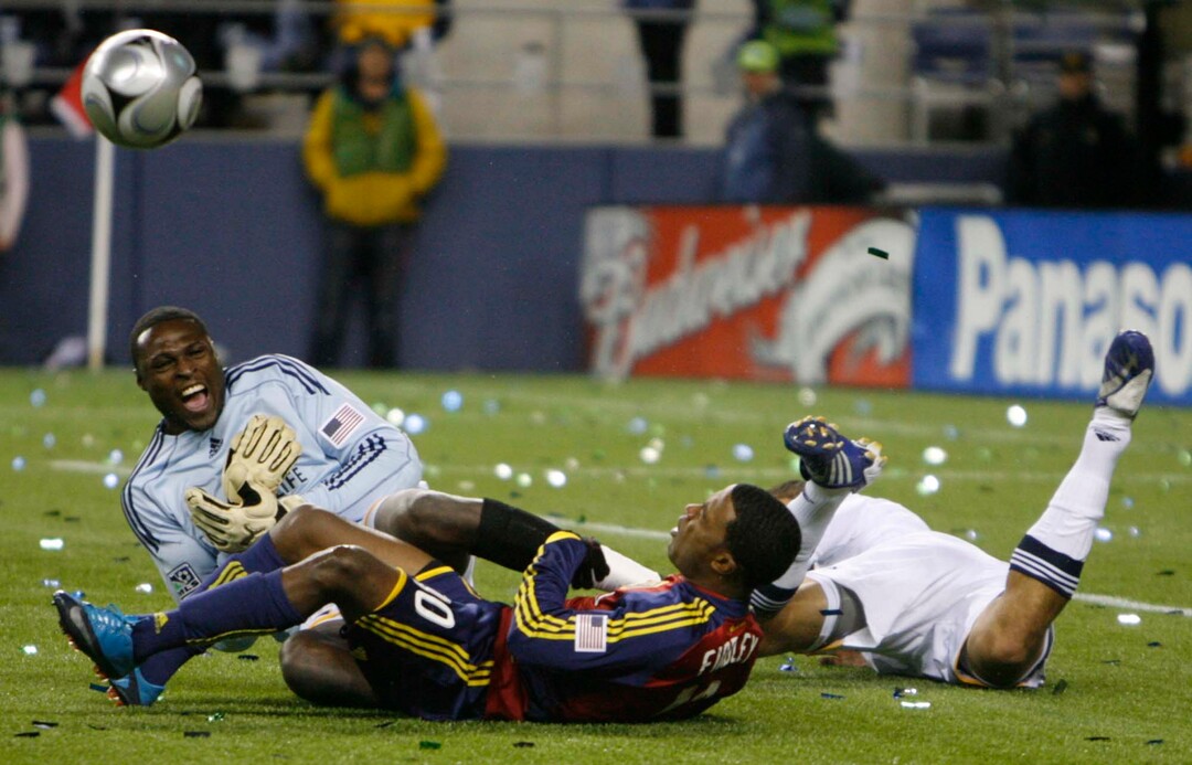 (Trent Nelson  |  Tribune file photo) Real Salt Lake forward Robbie Findley (10) collides with L.A. Galaxy's goalkeeper Donovan Ricketts during the MLS Cup on Sunday at Seattle's Qwest Field. RSL won the MLS Cup 5-4 during the penalty round.