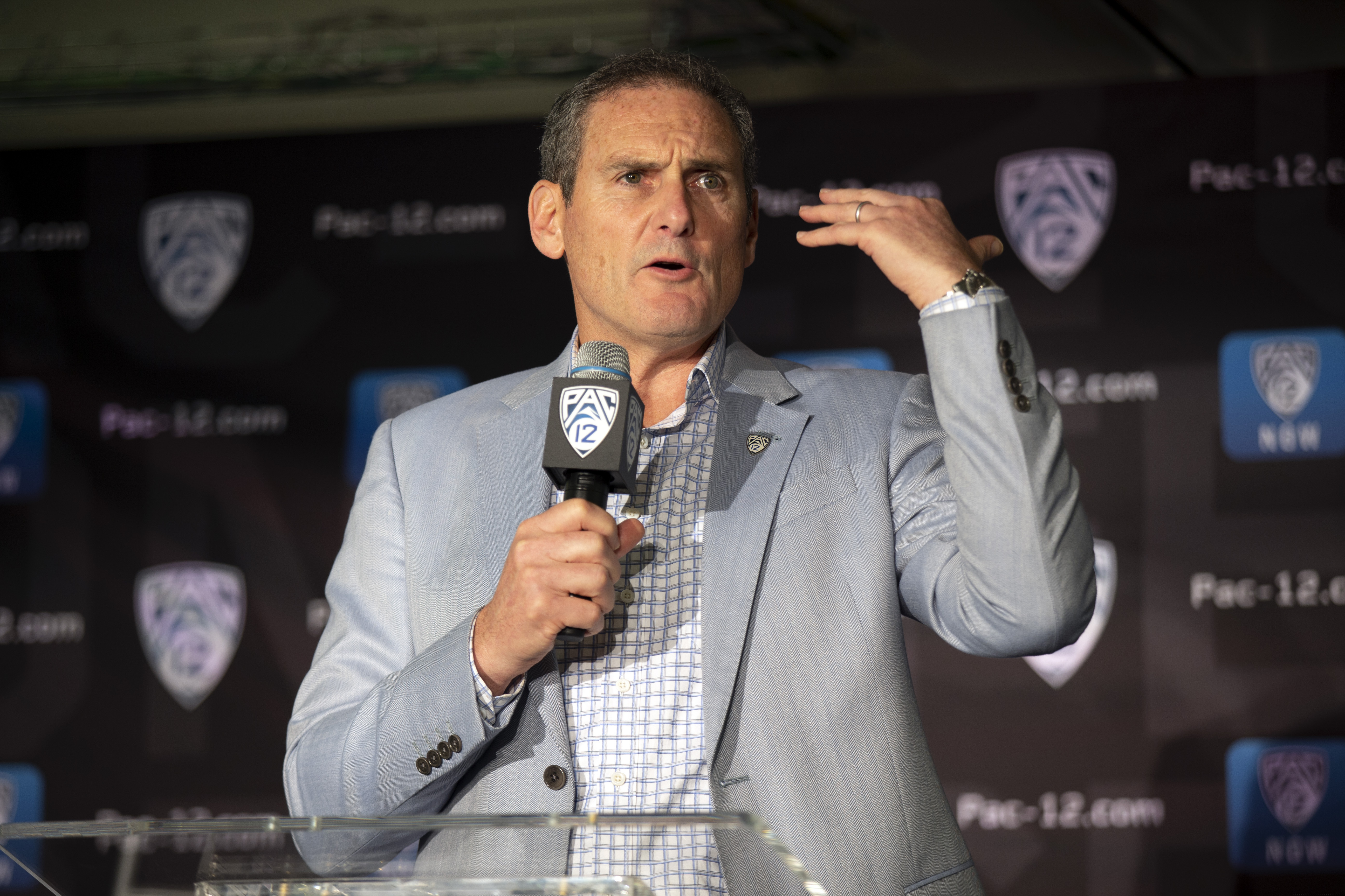 FILE - In this Oct. 8, 2019, file photo, commissioner Larry Scott speaks during the Pac-12 NCAA college basketball media day, in San Francisco. The commissioners of the Atlantic Coast Conference, Big Ten, Big 12, Pac-12 and Southeastern Conference say they have been in almost constant contact since the NCAA men's basketball tournament was canceled on March 12.“ Based on the very positive and close collaboration among the leaders in college football and discussions with schools, other leagues and the medical community, at this point in time we are planning to start the football season on time and together on a national basis,” Pac-12 Commissioner Larry Scott said. (AP Photo/D. Ross Cameron, File)