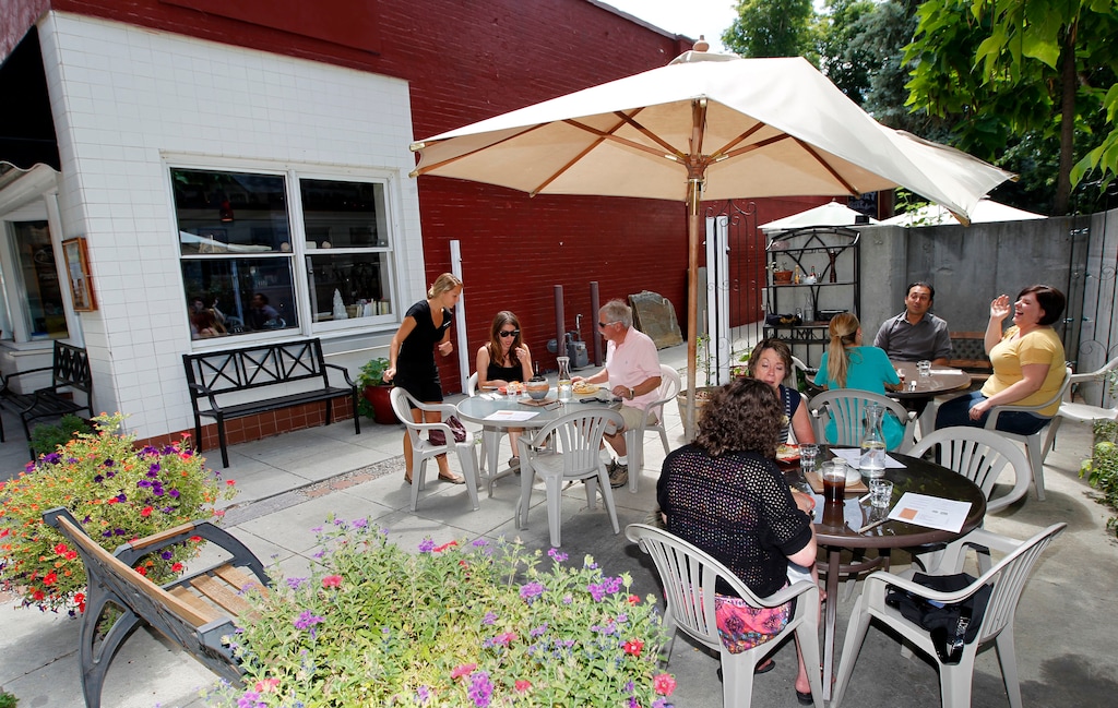 (Al Hartmann  |  Tribune file photo)  Lunch diners set on the patio at the Avenues Bistro on Third. Salt Lake City will allow restaurants and other retail businesses to expand onto private property during the coronavirus.