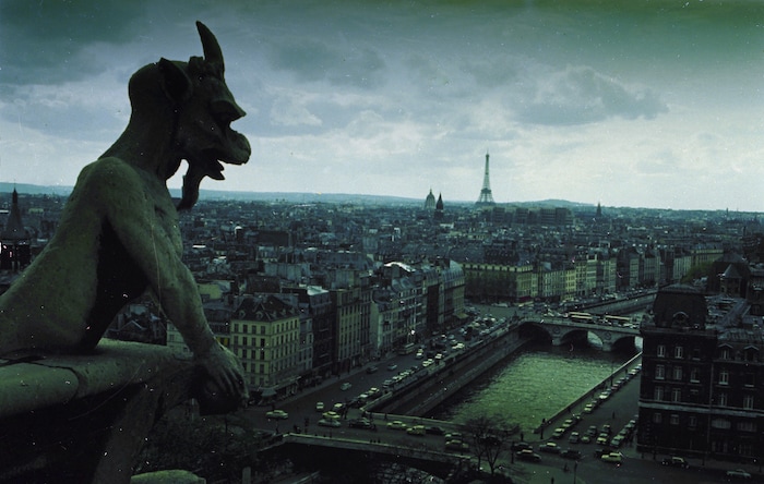 A Notre Dame gargoyle looks over the city of Paris, Dec. 1966.  In the background is the Eiffel Tower.  (AP Photo)