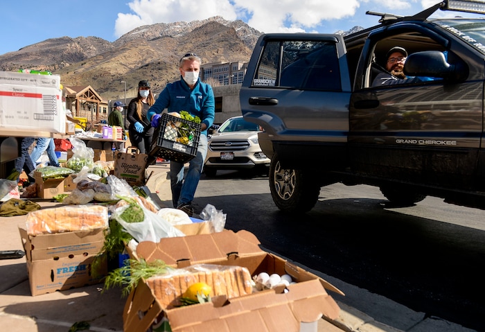 (Leah Hogsten  |  The Salt Lake Tribune)  Snowbird employees handed out over 10,000 pounds of perishable items from the ski resort's restaurants and stores to their workforce, March 21, 2020. The food included milk, eggs, bread, cheeses, every kind of herb, vegetable and fruit, including kumquats and lemon grass, and was given to Snowbird employees on a first-come, first-served basis.
