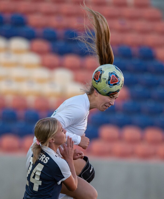 (Francisco Kjolseth  |  The Salt Lake Tribune) Mary Anderson #18 of Olympus gets the header over Rylee Lopaz #24 of Bonneville as they compete in their 5A high school girls championship game at Rio Tinto Stadium in Sandy on Friday, Oct. 23, 2020. Bonneville went on to win 1-0 in overtime.