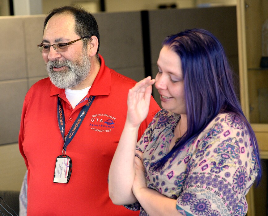 (Al Hartmann | The Salt Lake Tribune)
UTA honored FrontRunner operator Francis Rendon, left, for actions that saved an autistic child that ran and hid under his train as it had stopped while approaching the Layton station. The child's mother, Ashley Kofford, gets emotional giving her thanks to Rendon at UTA headquarters in Salt Lake City on Wednesday, April 11, 2018.