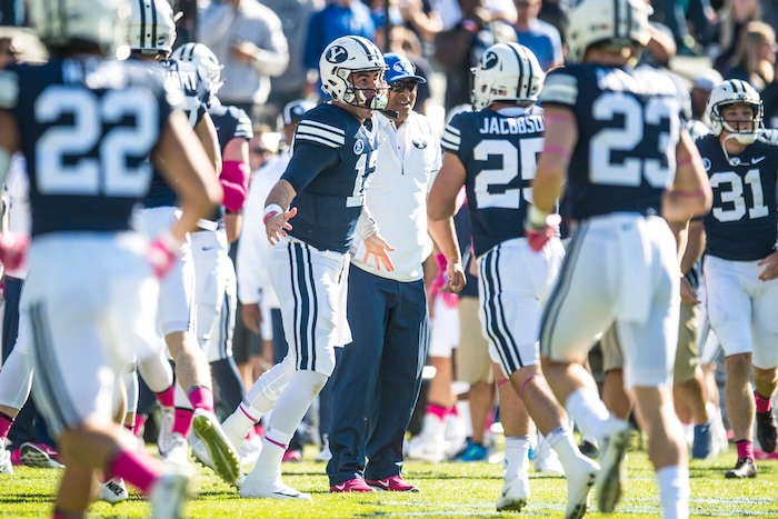(Chris Detrick  |  The Salt Lake Tribune)  Brigham Young Cougars quarterback Tanner Mangum (12) celebrates with his teammates after targeting was not called on Brigham Young Cougars running back Brayden El-Bakri (35) during the game at LaVell Edwards Stadium Saturday, October 28, 2017.  