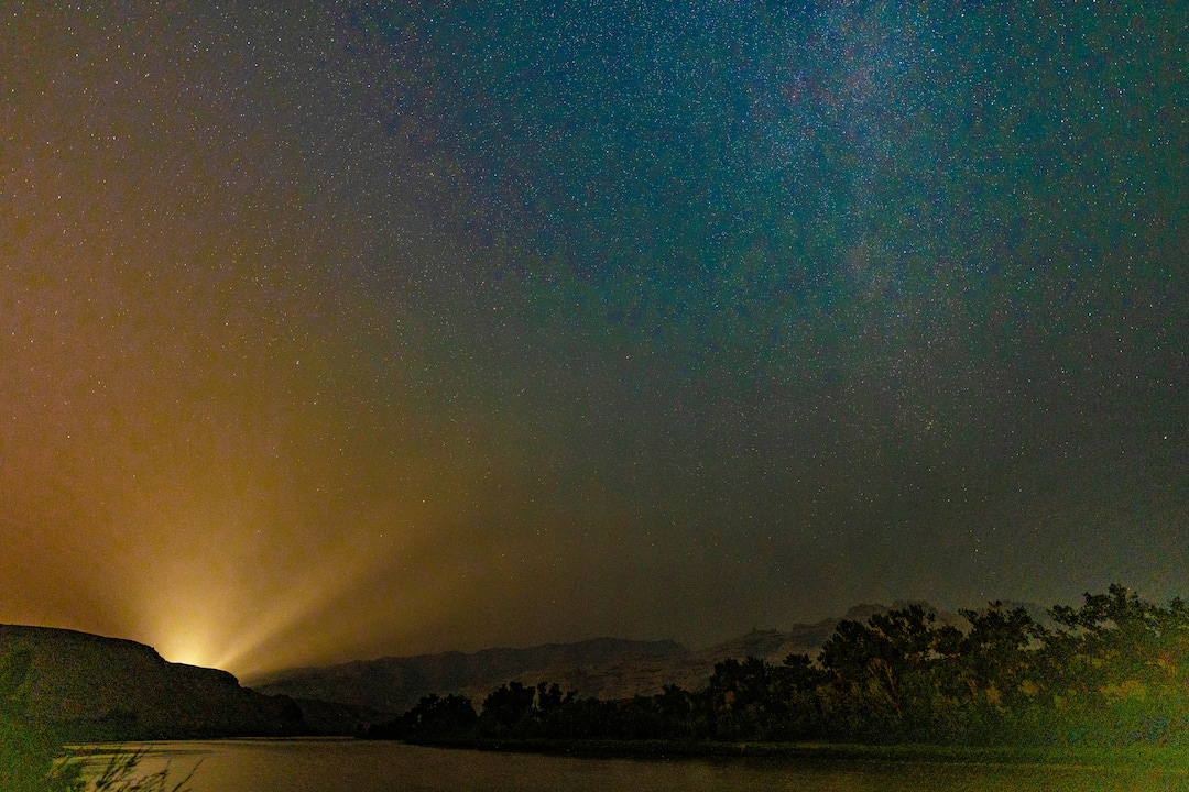 (Francisco Kjolseth | The Salt Lake Tribune) A passing car illuminates the heavy smoke pushed in by the California and Oregon fires as it obscures the night sky at Dinosaur National Monument, a certified International Dark Skies Park on Sunday, Aug. 8, 2019.