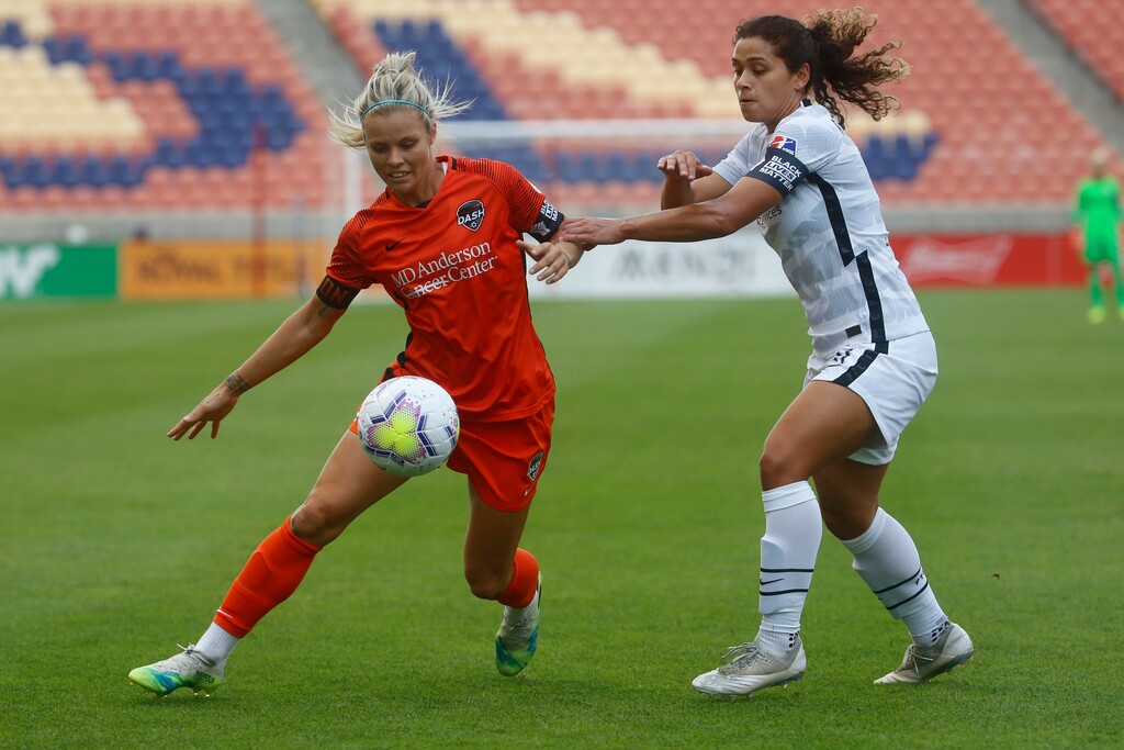 (Rick Bowmer | AP) Houston Dash forward Rachel Daly, left, battles for the ball against Portland Thorns' Rocky Rodriguez (11) during the first half of an NWSL Challenge Cup soccer semifinal match, Wednesday, July 22, 2020, in Sandy.