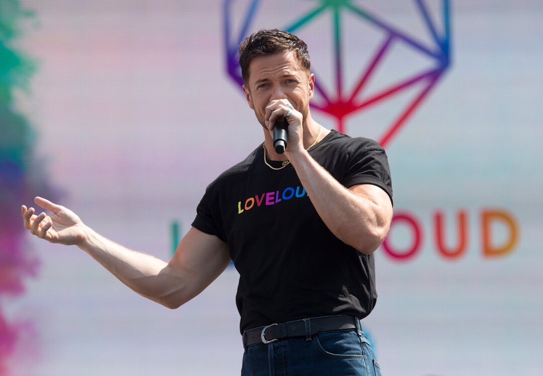 (Rick Egan  |  The Salt Lake Tribune)     Loveloud Founder Dan Reynolds greets the crowd at the start of the Loveloud Festival in the early afternoon, at Rice-Eccles Stadium, Saturday, July 28, 2018.