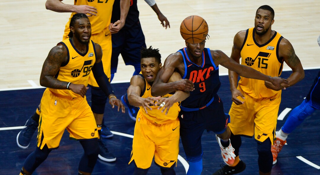 (Scott Sommerdorf | The Salt Lake Tribune)
Utah Jazz guard Donovan Mitchell (45) and Oklahoma City Thunder forward Jerami Grant (9) gets tangled up as they go after a loose ball during second half play. The Utah Jazz defeated the Oklahoma City Thunder 96-91 to win the first round playoff series, Friday, April 27, 2018.