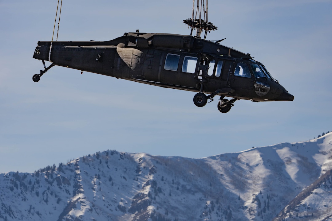 (Francisco Kjolseth | The Salt Lake Tribune) Recovery operations for two Utah Army National Guard UH-60 Black Hawk helicopters involved in a training accident in the Mineral Basin area last week are performed by a CH-47 Chinook helicopter and brought to the Heber Valley Airport on Wednesday, March 2, 2022.