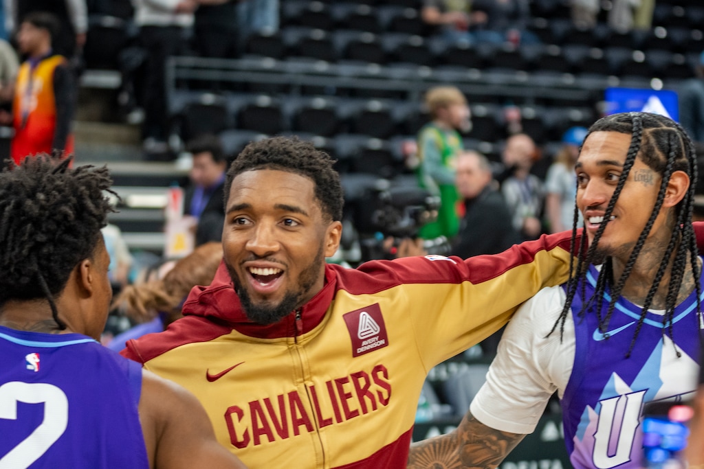 (Rick Egan | The Salt Lake Tribune) Utah Jazz guard Collin Sexton (2) greets Cleveland Cavaliers guard Donovan Mitchell (45) along with Jazz guard Jordan Clarkson (00) an NBA game between the Utah Jazz and the Cleveland Cavaliers at the Delta Center, on Sunday, March 23, 2025.