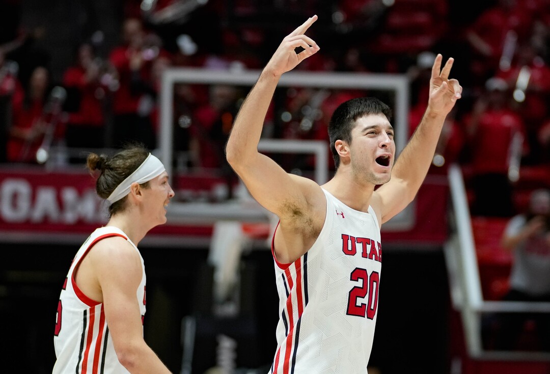 (Francisco Kjolseth | The Salt Lake Tribune) Utah Utes guard Lazar Stefanovic (20) and Utah Utes guard Gabe Madsen (55) celebrate their 81 to 66 win against the Arizona Wildcats in NCAA basketball in Salt Lake City on Thursday, Dec. 1, 2022.