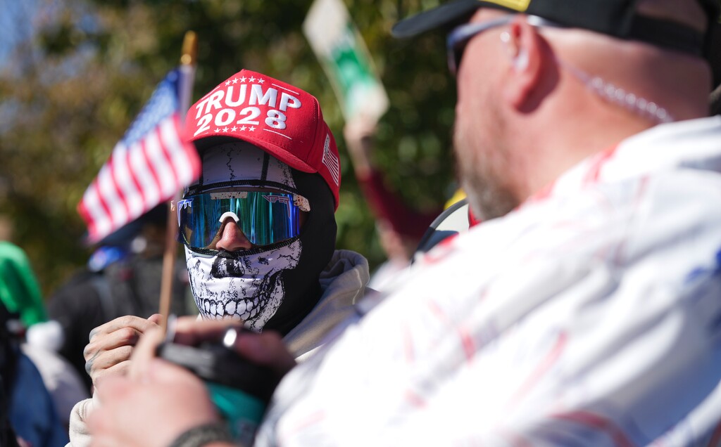 (Bethany Baker  |  The Salt Lake Tribune) A counterprotestor wears a hat with the slogan "Trump 2028" during a "No Kings" rally at the Utah Capitol in Salt Lake City on Saturday, Oct. 18, 2025.