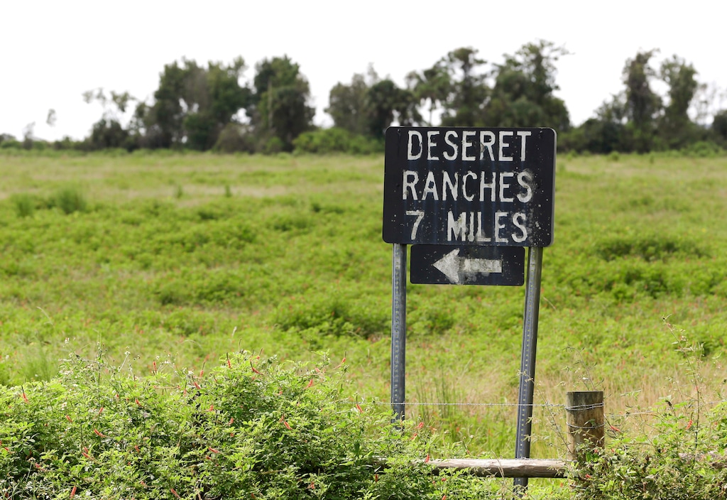 (John Raoux | AP) A sign, shown in 2015, gives directions to the Deseret Ranches offices in Florida. The Church of Jesus Christ of Latter-day Saints is buying 46 additional farms in eight U.S. states for $289 million.