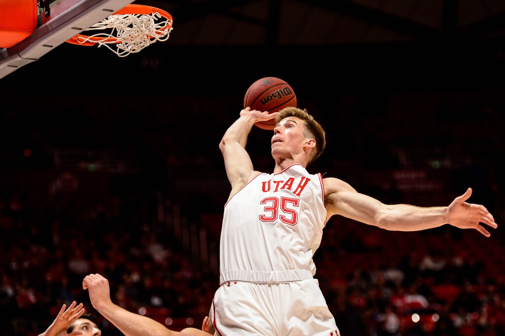 (Trent Nelson  |  The Salt Lake Tribune) Utah Utes center Branden Carlson (35) reaches for a loose ball as the University of Utah hosts Oregon State, NCAA men's basketball in Salt Lake City on Thursday, Jan. 2, 2020.