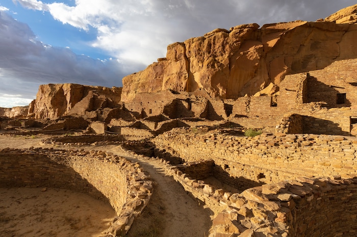 Pueblo Bonito, the largest and grandest of the 12 “great houses,” at the Chaco Culture National Historic Park in northwestern New Mexico, on Sept. 2, 2019. In the red rock desert of the Southwest, an ancient culture was thought to have vanished but a new view connects it to pueblo dwellers of today. (John Burcham/The New York Times)