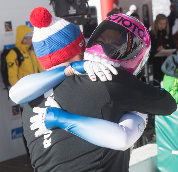 (Rick Egan  |  The Salt Lake Tribune)  Elena Nikitina, Russia, gets a hug at the finishline, as she finishes in first place in the BMW IBSF World Cup Skeleton competition, in Park City, Saturday, November 18, 2017.