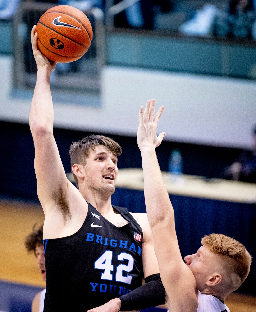 (Isaac Hale | Special to The Tribune) Brigham Young University center Richard Harward (42) shoots the ball over St. Mary's College forward Matthias Tass (11) during a game between the BYU Cougars and the Saint Mary’s College of California Gaels held at the Marriott Center in Provo on Saturday, Feb. 27, 2021.