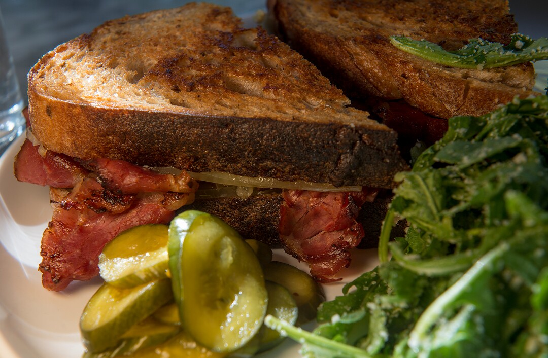 (Leah Hogsten  |  The Salt Lake Tribune) White Horse Spirits and Kitchen Reuben with house pastrami, sauerkraut, gruyere, Russian dressing on rye, $12.