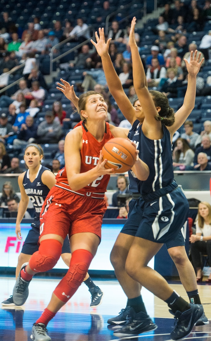 Rick Egan  |  The Salt Lake Tribune

Utah Utes forward Emily Potter (12) takes the ball up for a shot, as Brigham Young  forward Jasmine Moody (33) defends for the Cougars, in basketball action, BYU vs. The University of Utah,  in the Marriott Center, Saturday, December 12, 2015. 