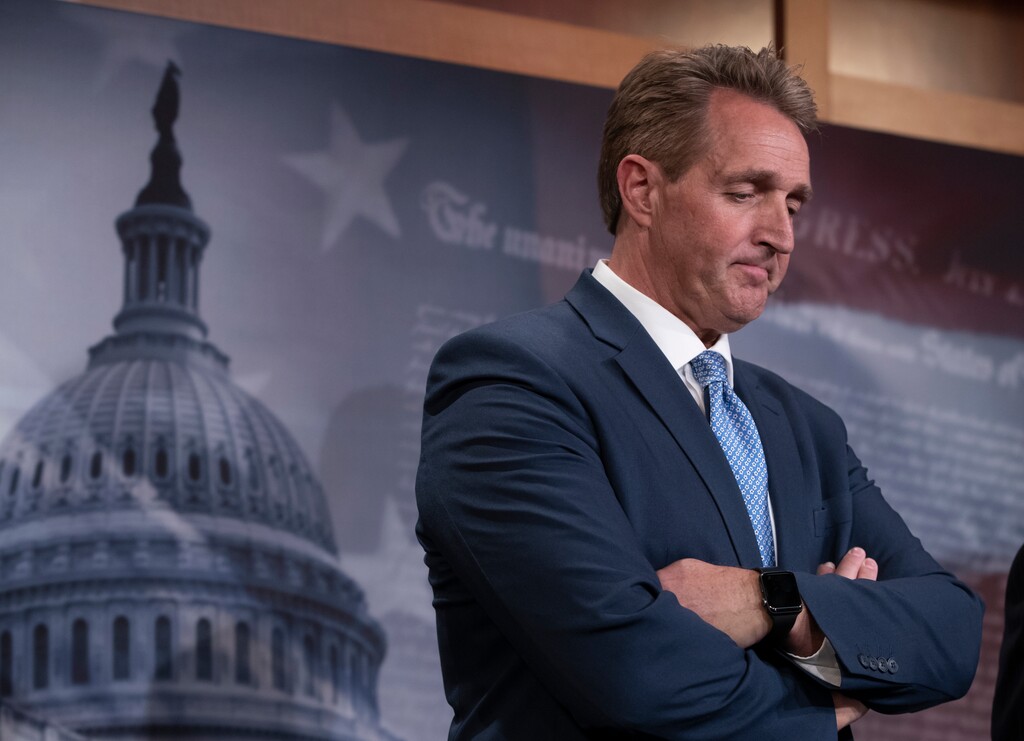 In this July 19, 2018, file photo, Sen. Jeff Flake, R-Ariz., talks to reporters after making a speech on the Senate floor on Capitol Hill in Washington. (AP Photo/J. Scott Applewhite, File)