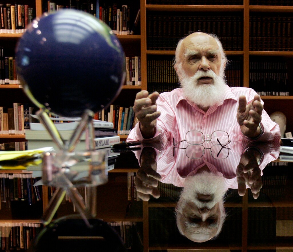 FILE - In this Friday, June 29, 2007, file photo, James Randi talks to a reporter in Fort Lauderdale, Fla. Magician Randi, whose daring escapes were later eclipsed by his work as the country’s foremost skeptic, has died. The Florida-based James Randi Educational Foundation announced its founder died Monday, Oct. 19, 2020, at 92. (AP Photo/Alan Diaz)
