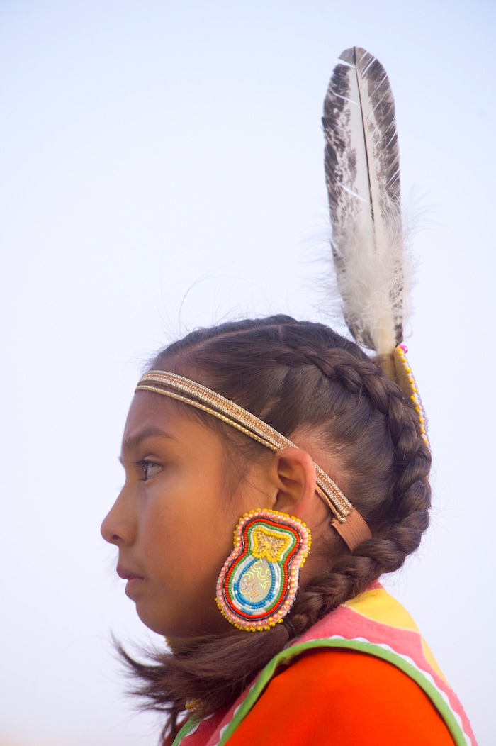 (Rick Egan  |  The Salt Lake Tribune)  Kayla Dashee, 10, of Holladay, prepares for her dance, during the Indigenous Peoples Day celebration, hosted by the Utah League of Native American Voters and PANDOS (Peaceful Advocates for Native Dialogue and Organizing Support) at the Salt Lake City Library, Monday, October 9, 2017.