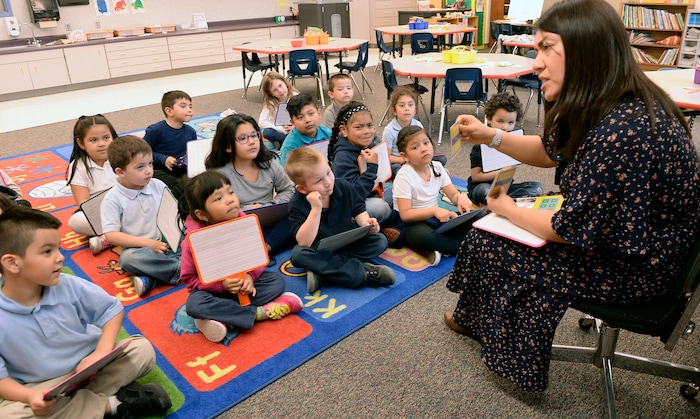 (Al Hartmann |  The Salt Lake Tribune) Kindergarten students work out math addition problems on their tablets in Denise White's class at Riley Elementary School in Salt Lake City Tuesday April 10, 2018. Utah’s average scores on the Nation’s Report Card for 2017 have improved from two years ago, but state officials remain concerned that minority and low-income students in the state continue to lag behind their peers.