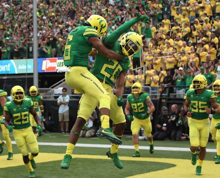 Oregon's Charles Nelson, center left, and Tony Brooks-James celebrate the latter's touchdown on the first play of the game against Southern Utah in an NCAA college football game Saturday, Sept. 2, 2017, in Eugene, Ore. (AP Photo/Chris Pietsch)