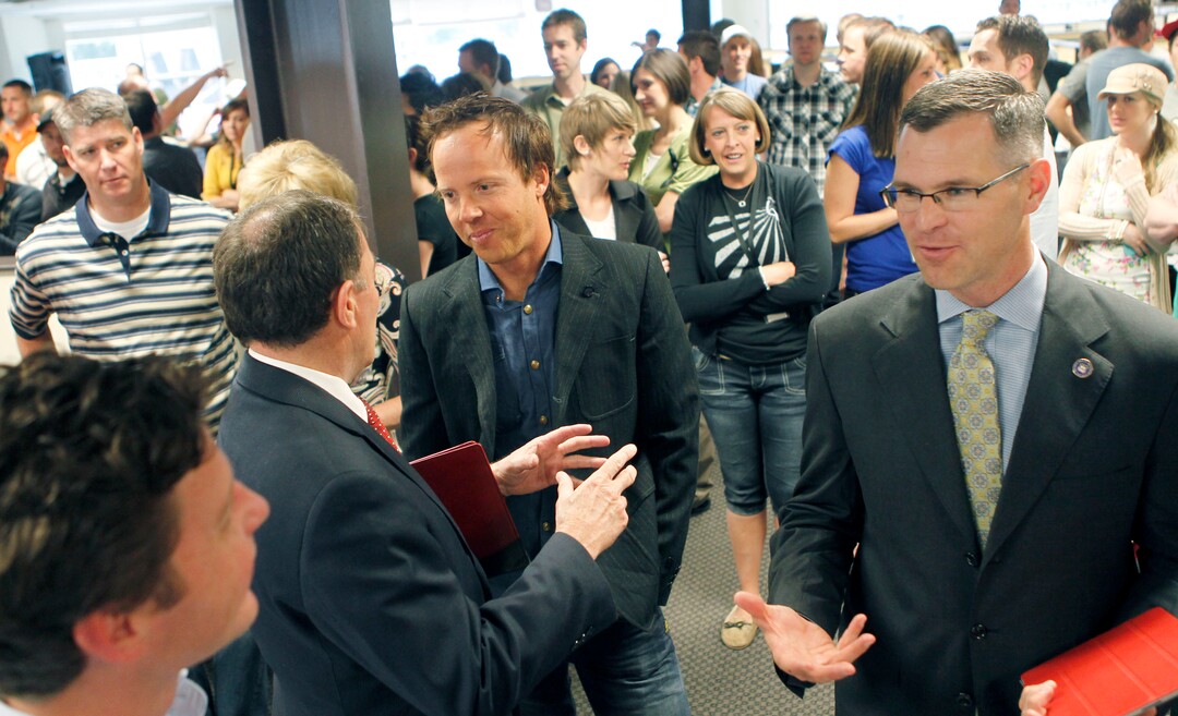 (Al Hartmann  |  Tribune file photo) Utah Gov. Gary Herbert, left, talks to Qualtrics CEO Ryan Smith at the company's headquarters in Orem in 2012.