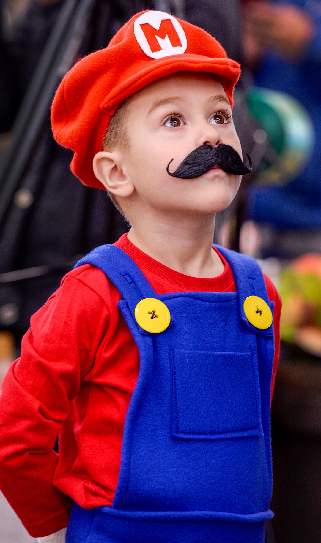 (Leah Hogsten  |  The Salt Lake Tribune)  Jack Wright, 4, waits patiently to begin trick or treating throughout Maceys grocery store. Utah First Lady Jeanette Herbert handed out reflective totes to children in their Halloween costumes at Maceys grocery store and lead them around the store for trick or treating, Oct. 24, 2019 to ramp up child safety awareness this Halloween.