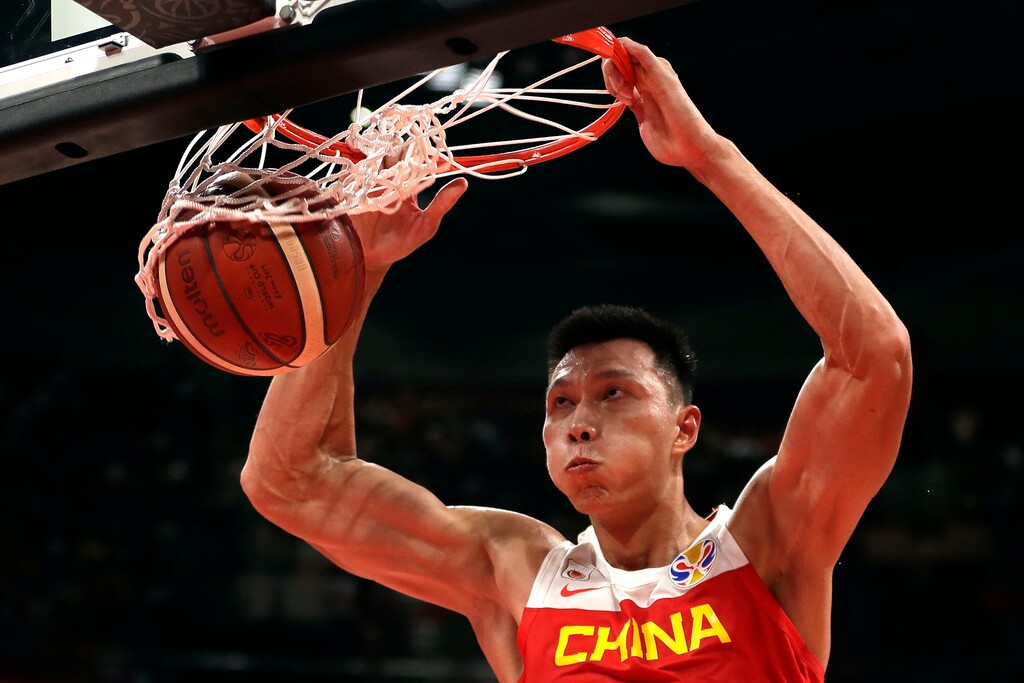 Yi Jianlian of China dunks the ball during their group phase basketball game against Ivory Coast in the FIBA Basketball World Cup at the Cadillac Arena in Beijing, Saturday, Aug. 31, 2019. (AP Photo/Mark Schiefelbein)