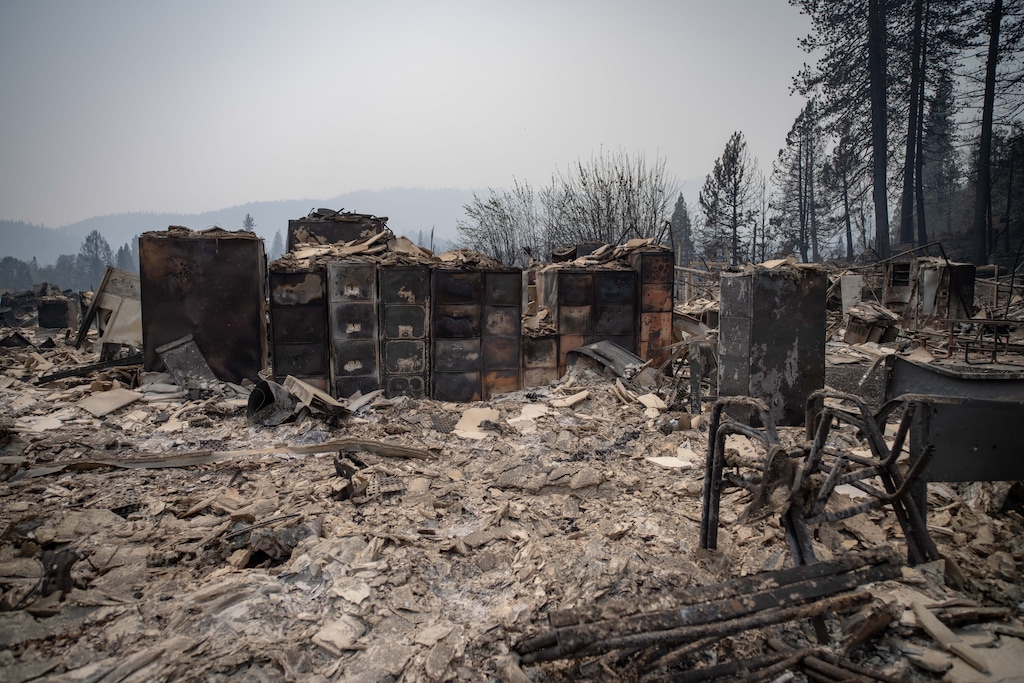 (Christian Monterrosa|The New York Times) File cabinets left standing after they were burned at the Greenville Rancheria Fire office in Greenville, Calif., Aug. 8, 2021. Over the weekend the Dixie fire burned through enough of the Sierra Nevada to become the second largest fire in California’s history.