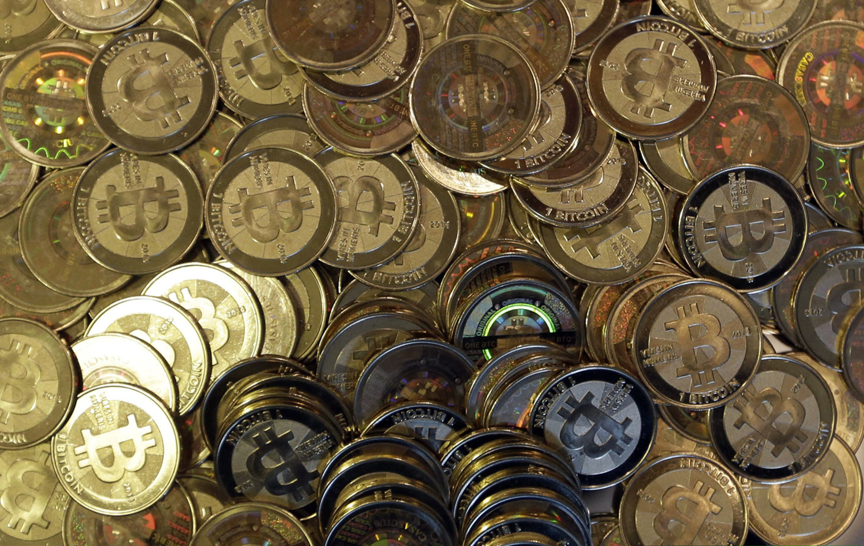(Rick Bowmer | AP file photo) This April 3, 2013 photo shows bitcoin tokens in Sandy, Utah. Unidentified hackers broke into the Twitter accounts of technology moguls, politicians, celebrities and major companies Wednesday, July 15, 2020, in an apparent Bitcoin scam.