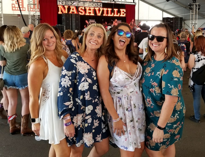 This undated photo provided by Ryan Miller shows Nicol Kimura, second from right with Michelle Miller, Tracy Gyurina, and Heather Bodwell. Kimura was one of the people killed in Las Vegas after a gunman opened fire on Sunday, Oct. 1, 2017, at a country music festival. (Ryan Miller via AP)