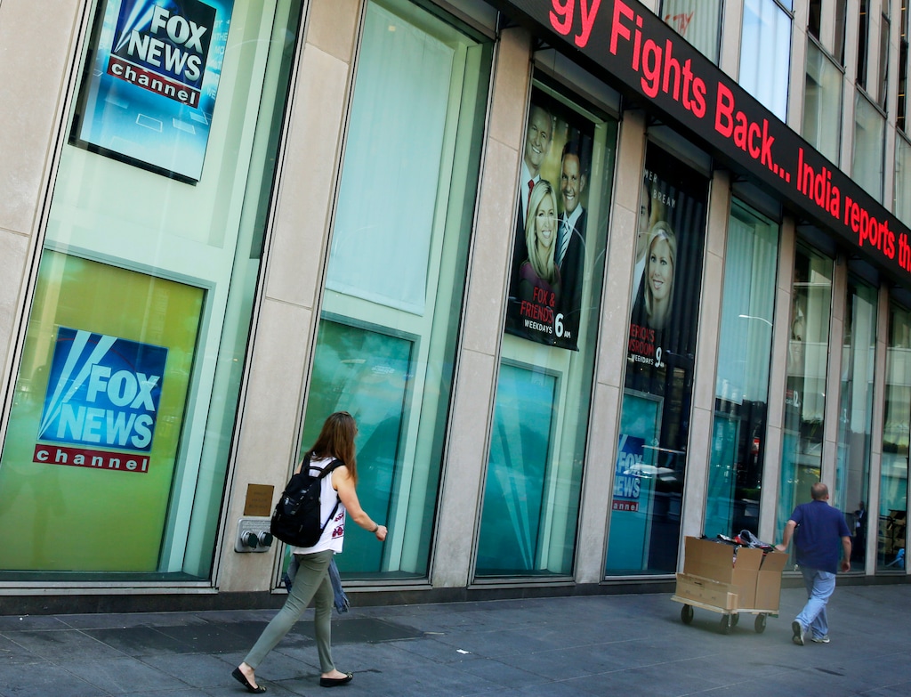 (AP Photo/Richard Drew, File)

People pass the News Corporation headquarters building and Fox News studios in New York on Aug. 1, 2017.