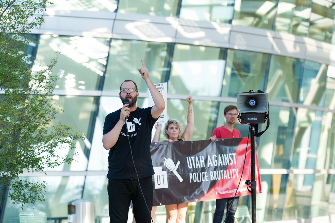 (Alex Gallivan | Special to the Tribune) David Newlin leads the crowd in chants at an Emergency Rally hosted by Utah Against Police Brutality, in response to the arrest of U of U nurse Alex Wubbels. Wubbels was arrested by SLCPD Detective Jeff Payne after she refused to take blood from an unconscious patient, which is against hospital policy.