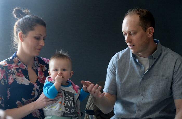 Al Hartmann  |  The Salt Lake Tribune  Janell and Elliot Lewis play with their baby Evie at a press conference at the Utah Public Health Laboratory Wednesday Jan. 31. Evie was was tested for spinal muscular atrophy because the Lewis' first daughter Blakely died from the genetic mutation. Evie received treatment for the condition early on.  The Utah Department of Health announced they're going to start testing every infant born in the state for spinal muscular atrophy. The neurodegenerative disease is the leading genetic cause of death for infants, affecting one in 11,000.  