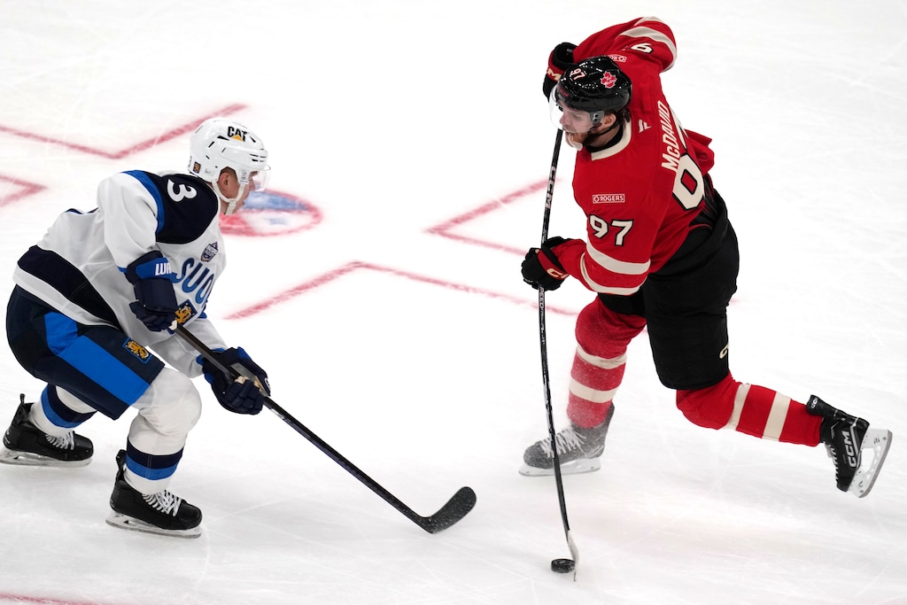 Canada's Connor McDavid (97) takes a shot against Finland's Olli Maatta during the first period of a 4 Nations Face-Off hockey game, Monday, Feb. 17, 2025, in Boston. (AP Photo/Charles Krupa)