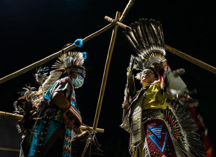 (Leah Hogsten | The Salt Lake Tribune Chicken dancer Weston Jones, 12, talks with his friend, traditional warrior dancer Lone Wolf Joe, 9, at the 41st Annual Paiute Indian Tribe of Utah Restoration Gathering, Aug. 13, 2021 in Cedar City, Utah. Both boys are members of the Navajo and Hopi Indian Tribes.