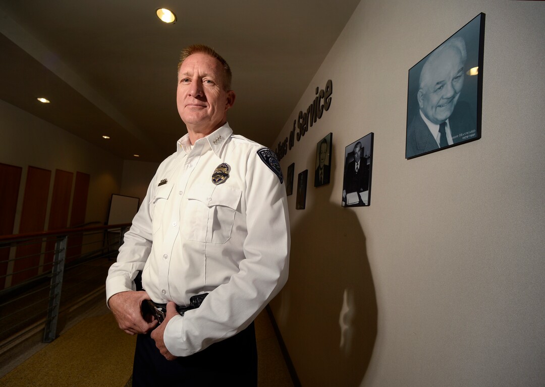 Scott Sommerdorf   |  The Salt Lake Tribune  Sheriff Jim Winder poses for a portrait in the hallway at the Salt Lake Sheriff's building where portraits of former Sheriffs are posted, Saturday, July 15, 2017. 