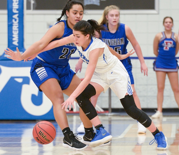 (Leah Hogsten  |  The Salt Lake Tribune) Fremont's Mazzie Melaney (15) drives around Bingham's Journey Tupea (21). Fremont defeated Bingham 61-47 to win the 6A High School Girls' Basketball Tournament title at SLCC in Taylorsville,Saturday, Feb. 24, 2018. 